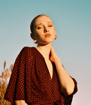 A model in a wine patterned wrap top