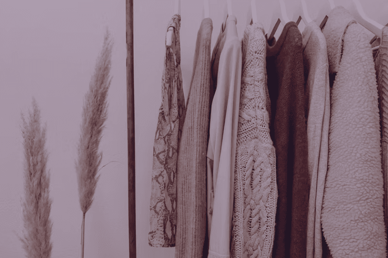 Knitwear hanging on a clothes rail